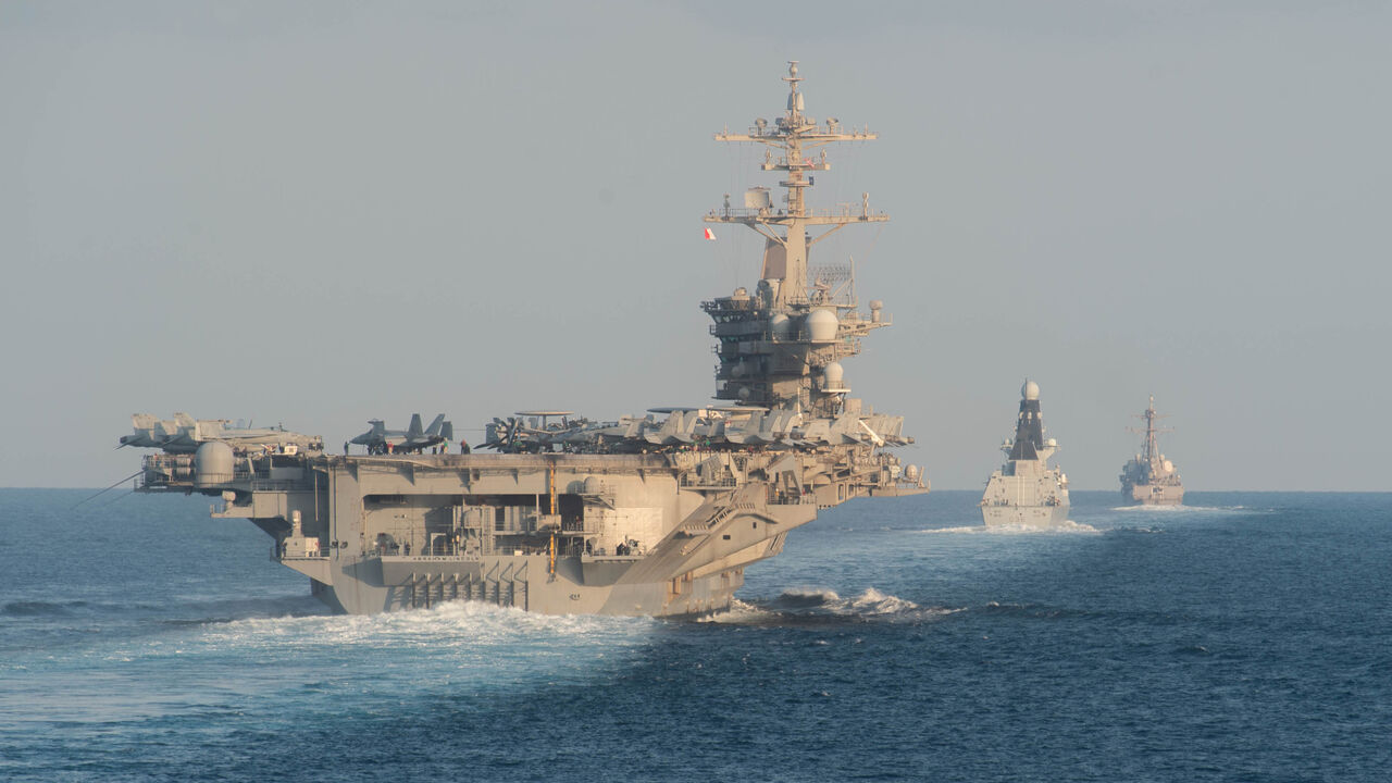191119-N-DS741-1049 STRAIT OF HORMUZ (Nov. 19, 2019) The aircraft carrier USS Abraham Lincoln (CVN 72), left, the Royal Navy air defense destroyer HMS Defender (D 36) and the guided-missile destroyer USS Farragut (DDG 99) transit the Strait of Hormuz. The Abraham Lincoln Carrier Strike Group is deployed to the U.S. 5th Fleet area of operations in support of naval operations to ensure maritime stability and security in the Central Region, connecting the Mediterranean and the Pacific through the western Indian Ocean and three strategic choke points. With Abraham Lincoln as the flagship, deployed strike group assets include staffs, ships and aircraft of Carrier Strike Group (CSG) 12, Destroyer Squadron (DESRON) 2, the guided-missile cruiser USS Leyte Gulf (CG 55) and Carrier Air Wing (CVW) 7. (U.S. Navy photo by Mass Communication Specialist 3rd Class Zachary Pearson/Released)