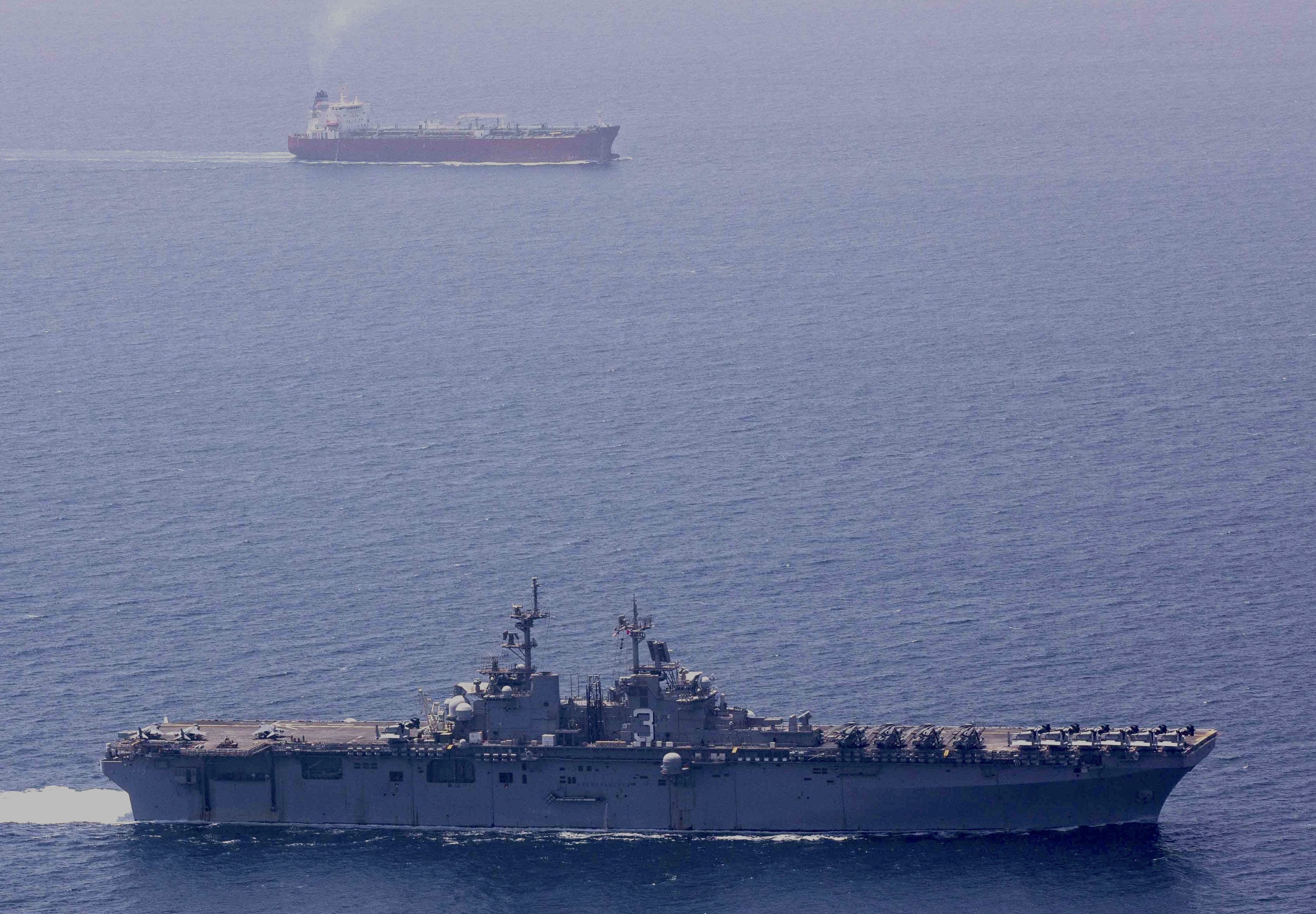 190507-N-YH603-1211 STRAIT OF HORMUZ (May 7, 2019) The Wasp-class amphibious assault ship USS Kearsarge (LHD 3) transits the Strait of Hormuz. Kearsarge is the flagship for the Kearsarge Amphibious Ready Group and, with the embarked 22nd Marine Expeditionary Unit, is deployed to the U.S. 5th Fleet area of operations in support of naval operations to ensure maritime stability and security in the Central Region, connecting the Mediterranean and the Pacific through the western Indian Ocean and three strategic choke points. (U.S. Navy photo by Mass Communication Specialist 2nd Class Casey Moore/Released)