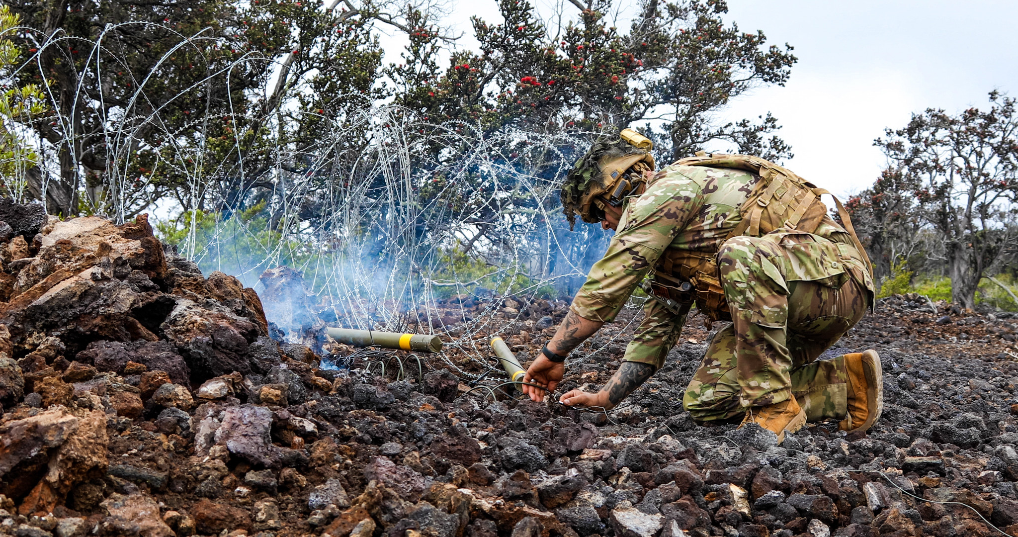 A U.S. Army Soldier assigned to 29th Brigade Engineer Battalion, 3rd Infantry Brigade Combat Team, 25th Infantry Division prepares a Bangalore breach during a live fire exercise une 1, 2023 at Pohakuloa Training Area, Hawaii. Soldiers demonstrated their tactical skills and knowledge while performing both day and night live fire training. (U.S. Army photo by Spc. Darbi Colson/3rd Infantry Brigade Combat Team)