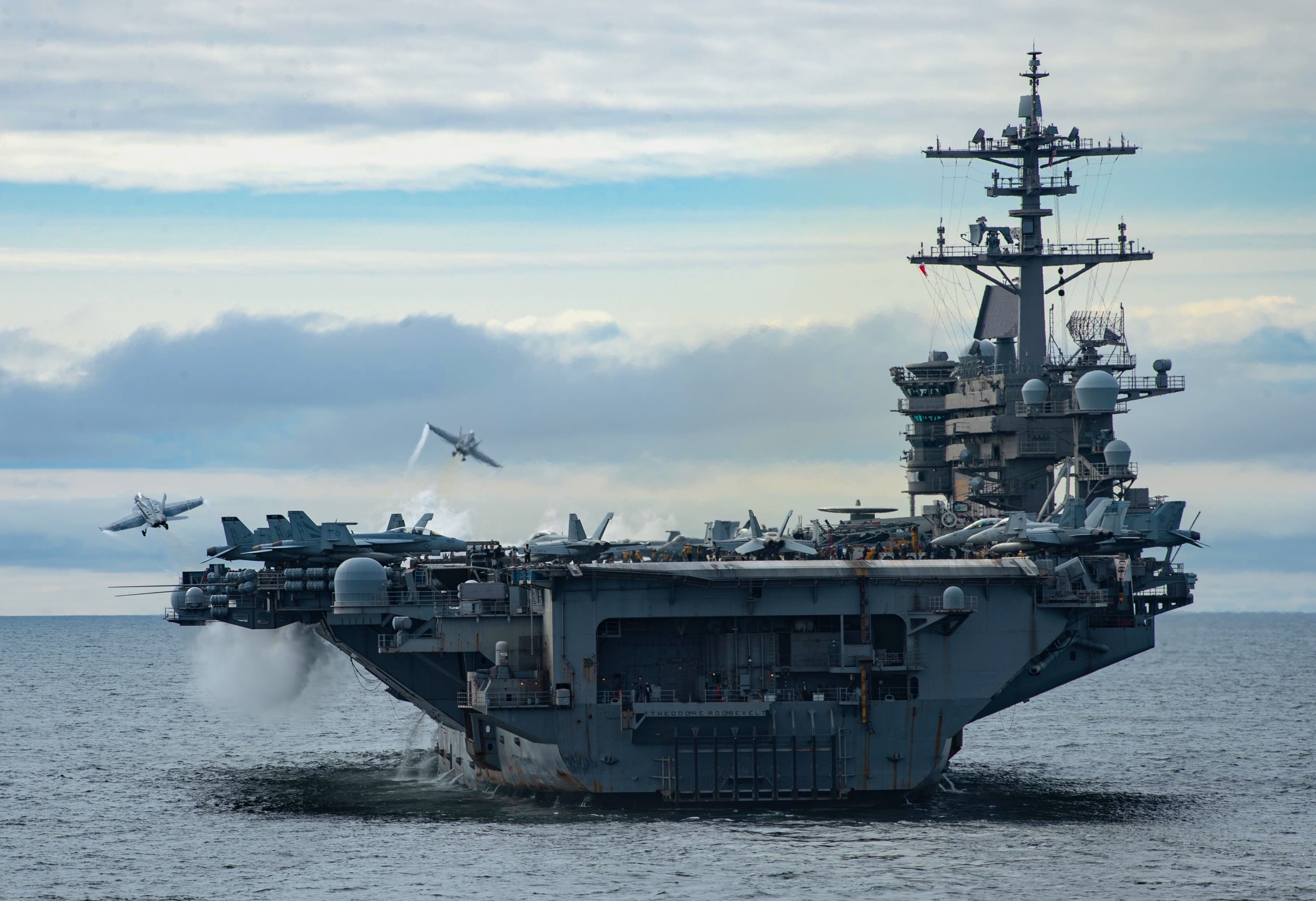 PACIFIC OCEAN (April 29, 2021) Two F/A-18 Super Hornets, assigned to Carrier Air Wing (CVW) 11, launch from the flight deck of the aircraft carrier USS Theodore Roosevelt (CVN 71) April 29, 2021. The Theodore Roosevelt Carrier Strike Group is on a scheduled deployment conducting routine operations in U.S. 3rd Fleet. (U.S. Navy photo by Mass Communication Specialist 3rd Class Erik Melgar)