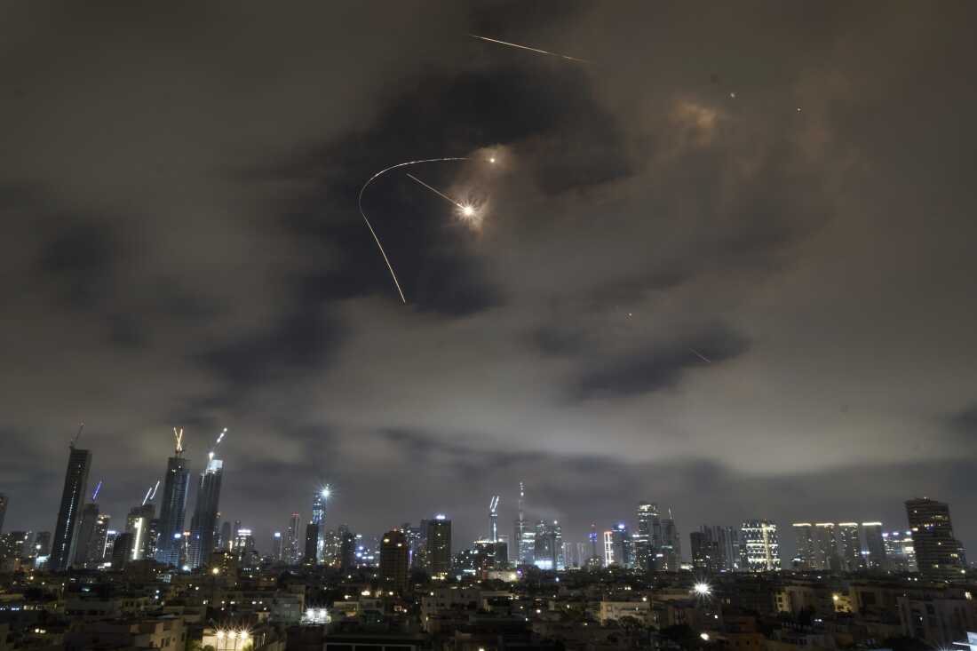 Israeli air defense system fires to intercept missiles during an Iranian attack over Tel Aviv, Israel, Saturday, June 21, 2025. (AP Photo/Leo Correa)
