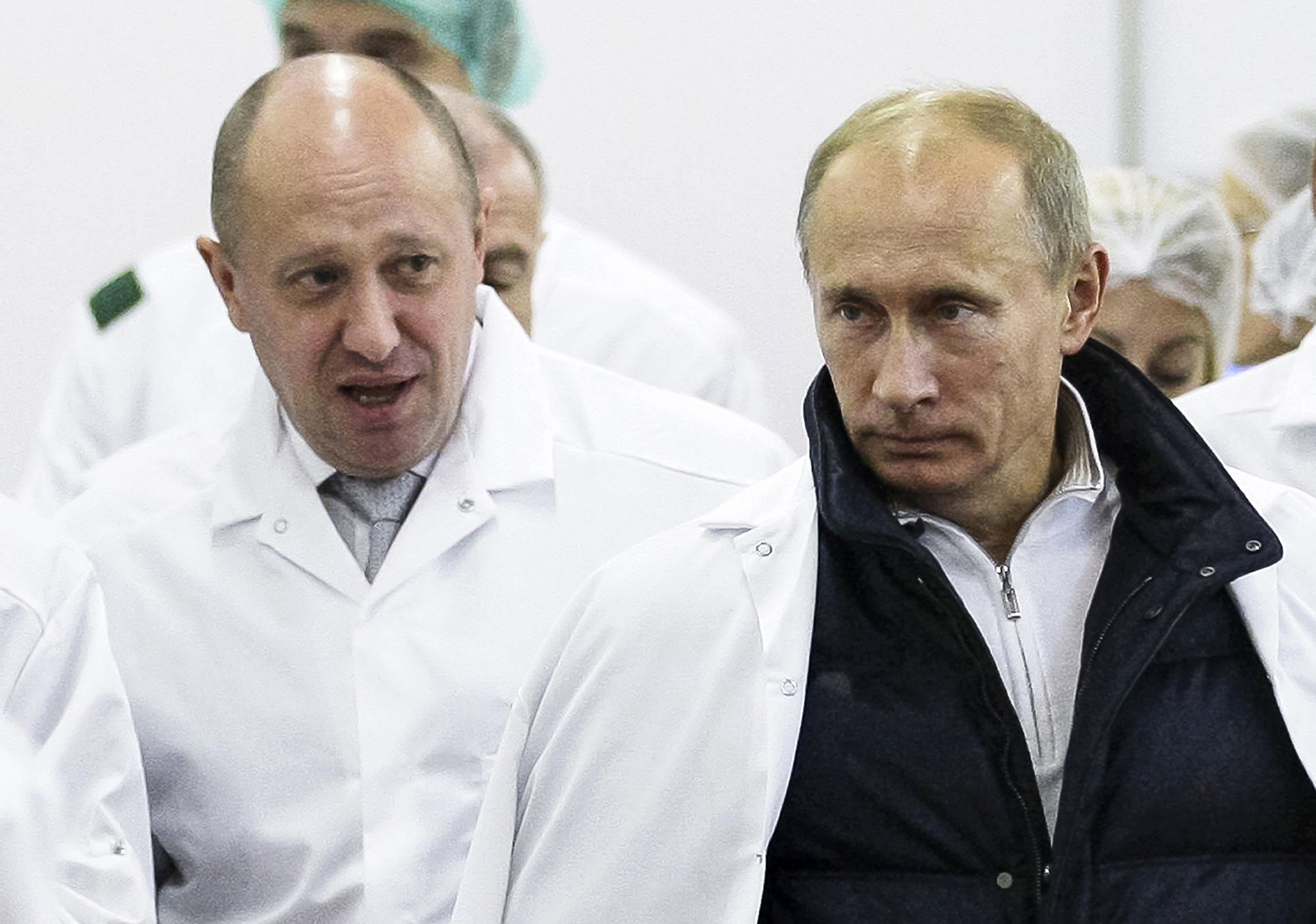 FILE - Businessman Yevgeny Prigozhin, left, shows Russian President Vladimir Putin, around his factory which produces school means, outside St. Petersburg, Russia on Sept. 20, 2010. Prigozhin, the millionaire owner of the Wagner Group private military company, has used his longtime ties with Russian President Vladimir Putin to increase his clout. (Sputnik, Kremlin Pool Photo via AP, File)
