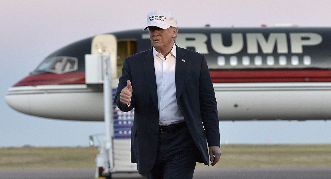 Republican presidential nominee Donald Trump walks across the tarmac as he arrives for a rally at the JetCenters of Colorado in Colorado Springs, Colorado on September 17, 2016. / AFP / Mandel Ngan (Photo credit should read MANDEL NGAN/AFP/Getty Images)