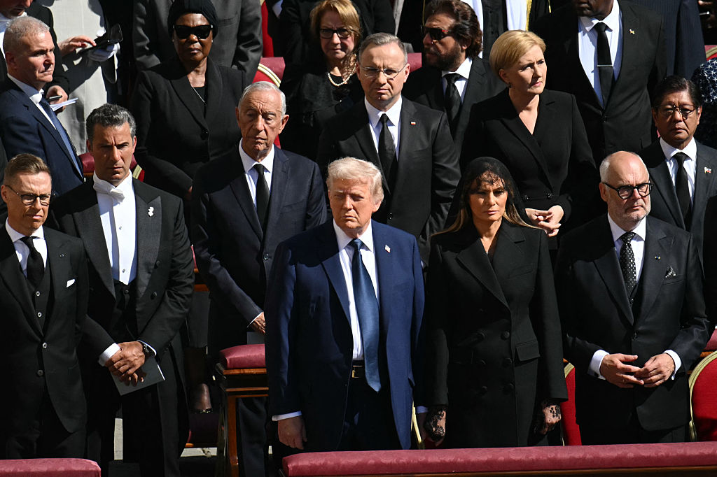 US President Donald Trump (C) and First Lady Melania Trump (C/R) stand alongside leaders including France's President Emmanuel Macron (L) and Finland's President Alexander Stubb (2L) as they attend the late Pope Francis' funeral ceremony at St Peter's Square at the Vatican on April 26, 2025. (Photo by Mandel NGAN / AFP)